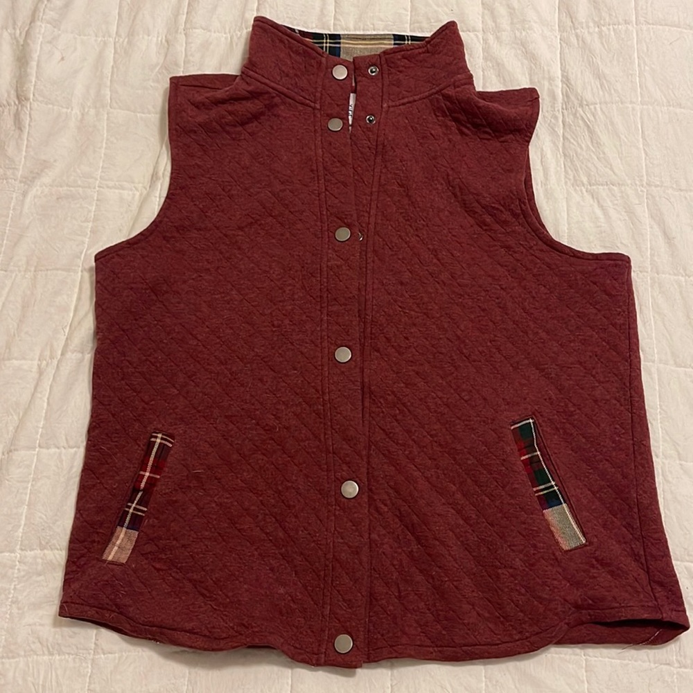 Thin but warm maroon vest.